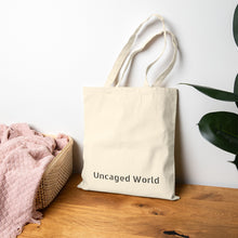 Load image into Gallery viewer, Uncaged World Cotton Canvas Tote Bag
